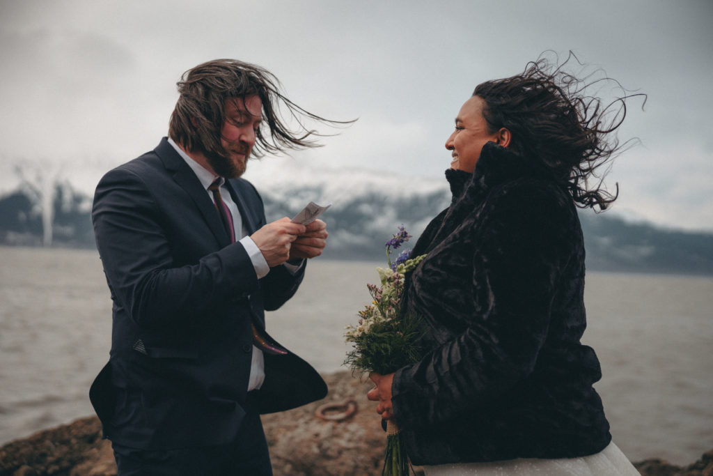 Jeff reads his vows to his bride during their Alaska elopement