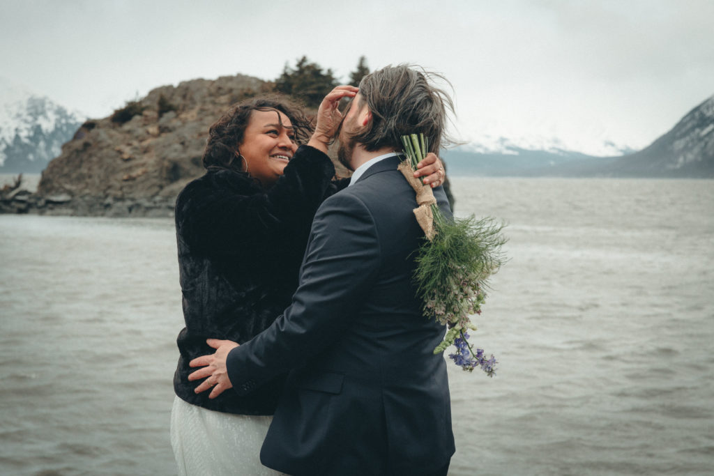 Calliope pushed back Jeff's wind-blown hair during their Alaska Elopement