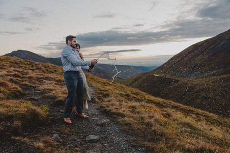 B & F pop a bottle of champagne on top of Hatcher Pass