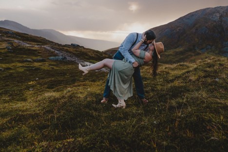 Fabi dips brooke at sunset at Hatcher Pass summit